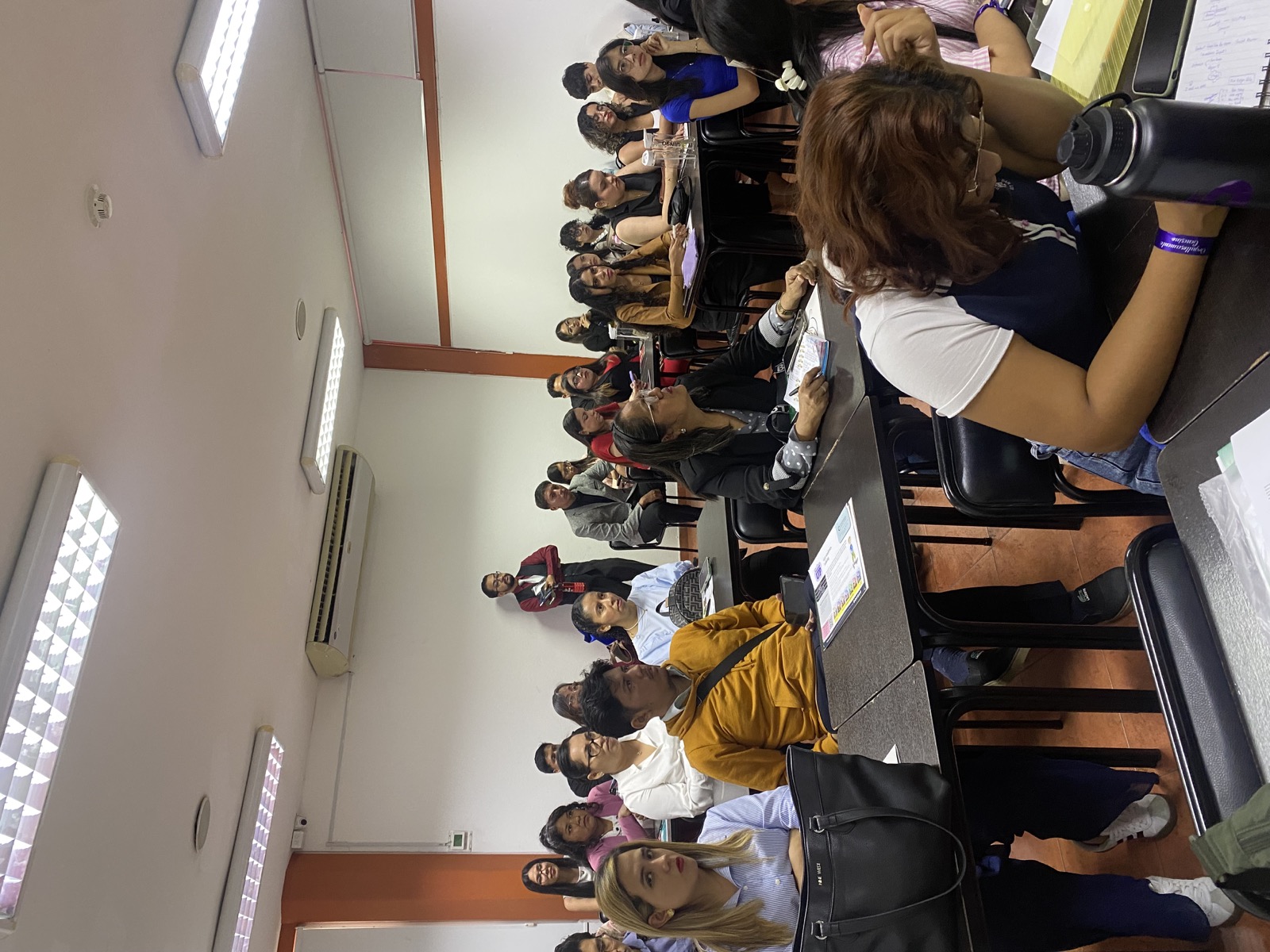 Speaker presenting to attendees in a classroom session.